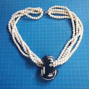 Wooden Beaded Multi-Strand Necklace With Art Deco Wooden Face Pendant 26"